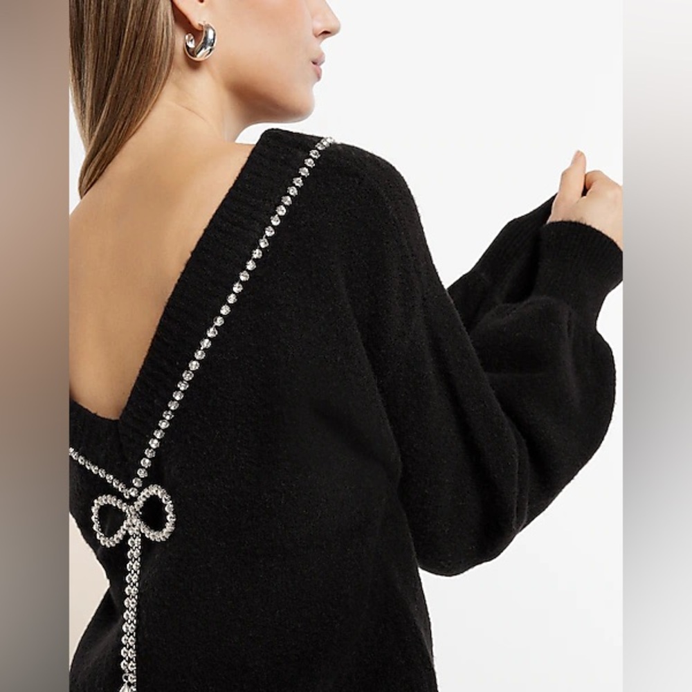 A cozy sweater to wear both ways with a touch of bling.